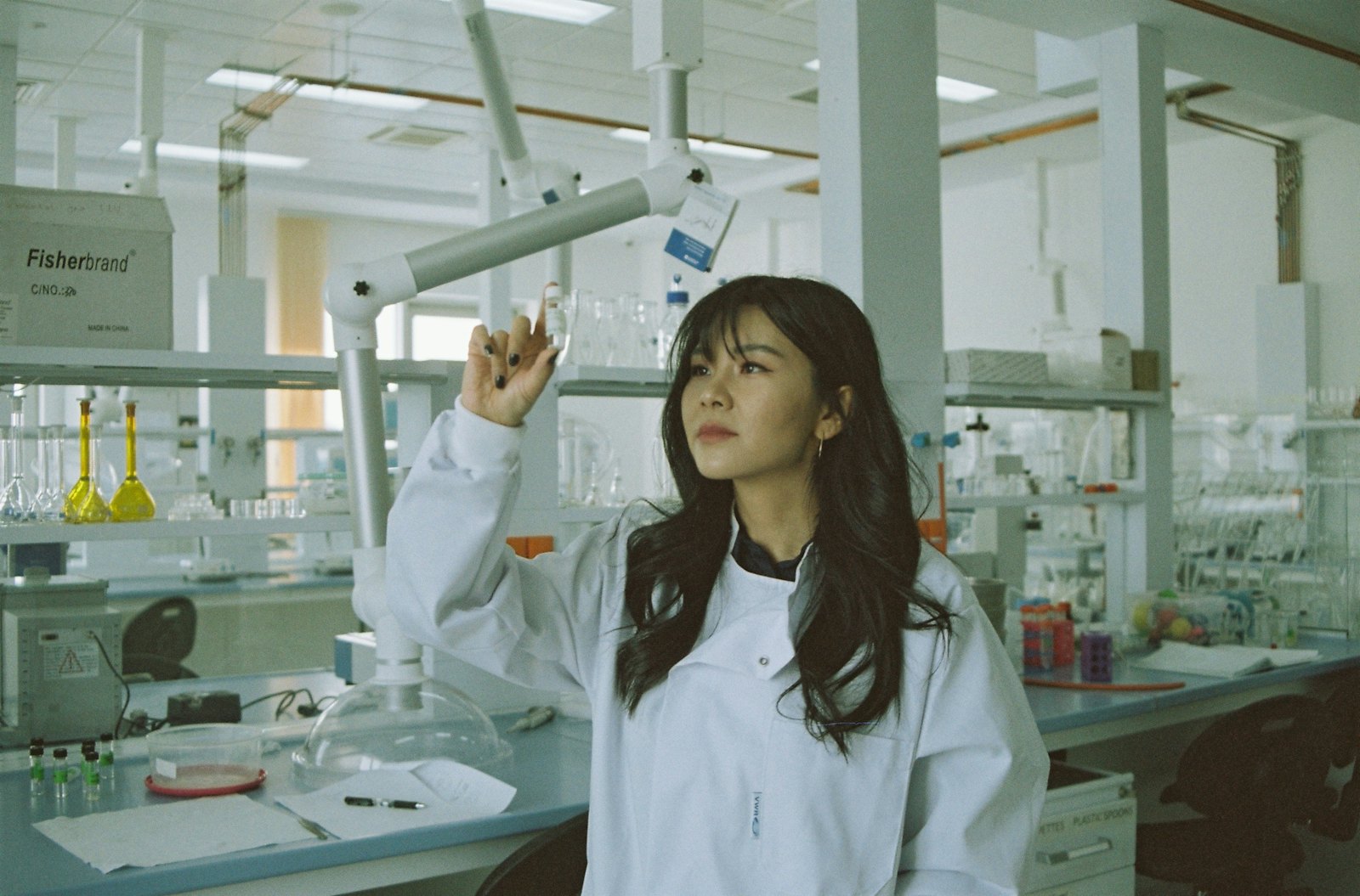 Immunology researcher at a microscope