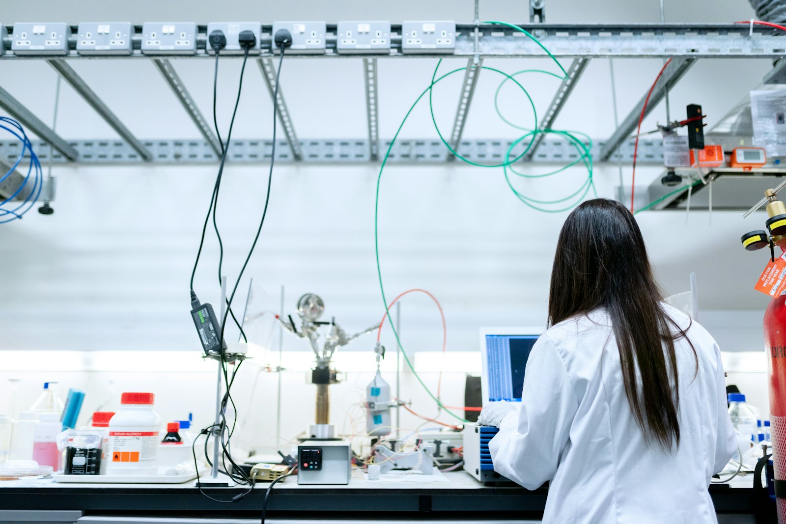 Analyst preparing a peptide sample at a chromatography bench